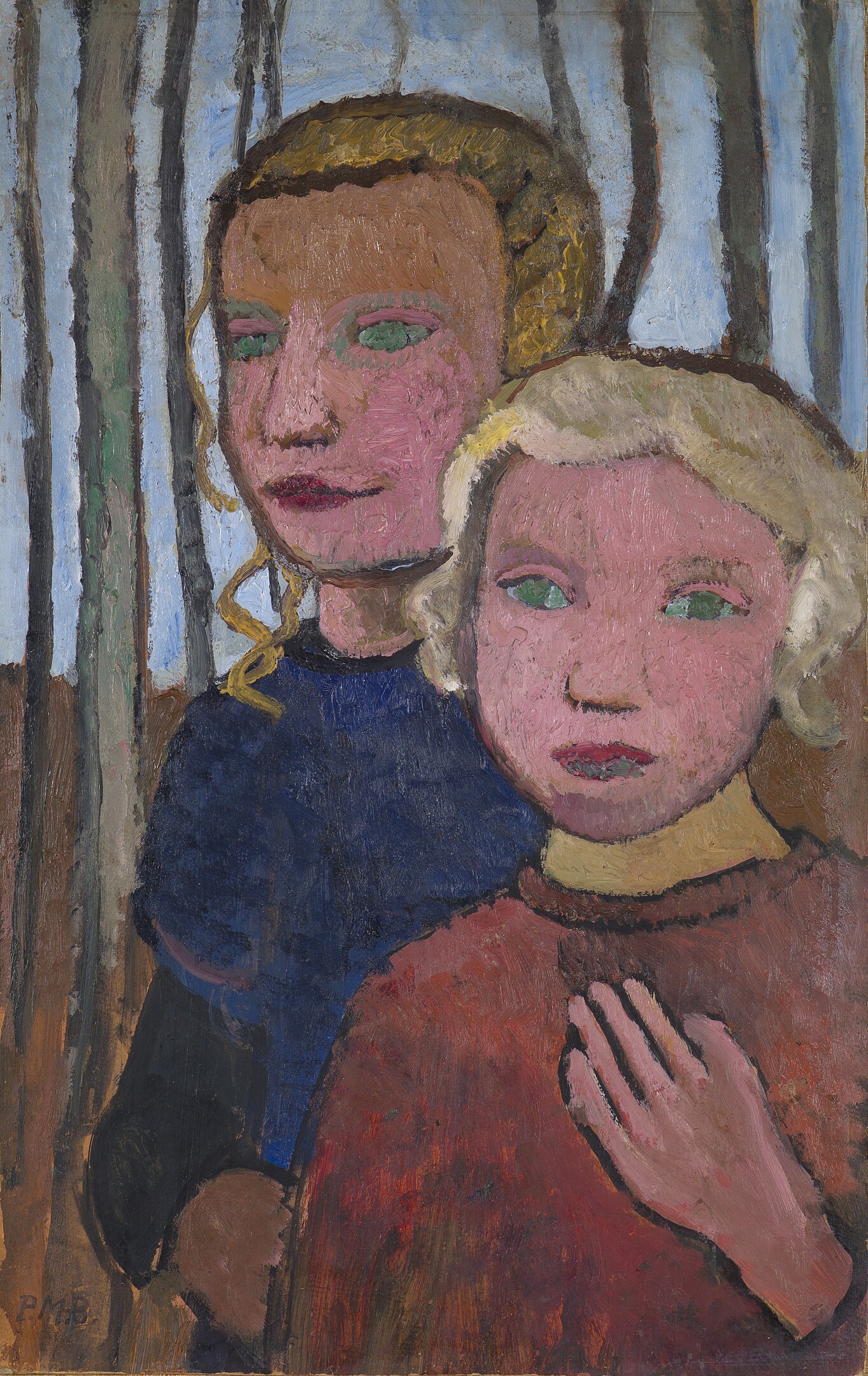 Two girls standing in the woods looking back at the viewer
