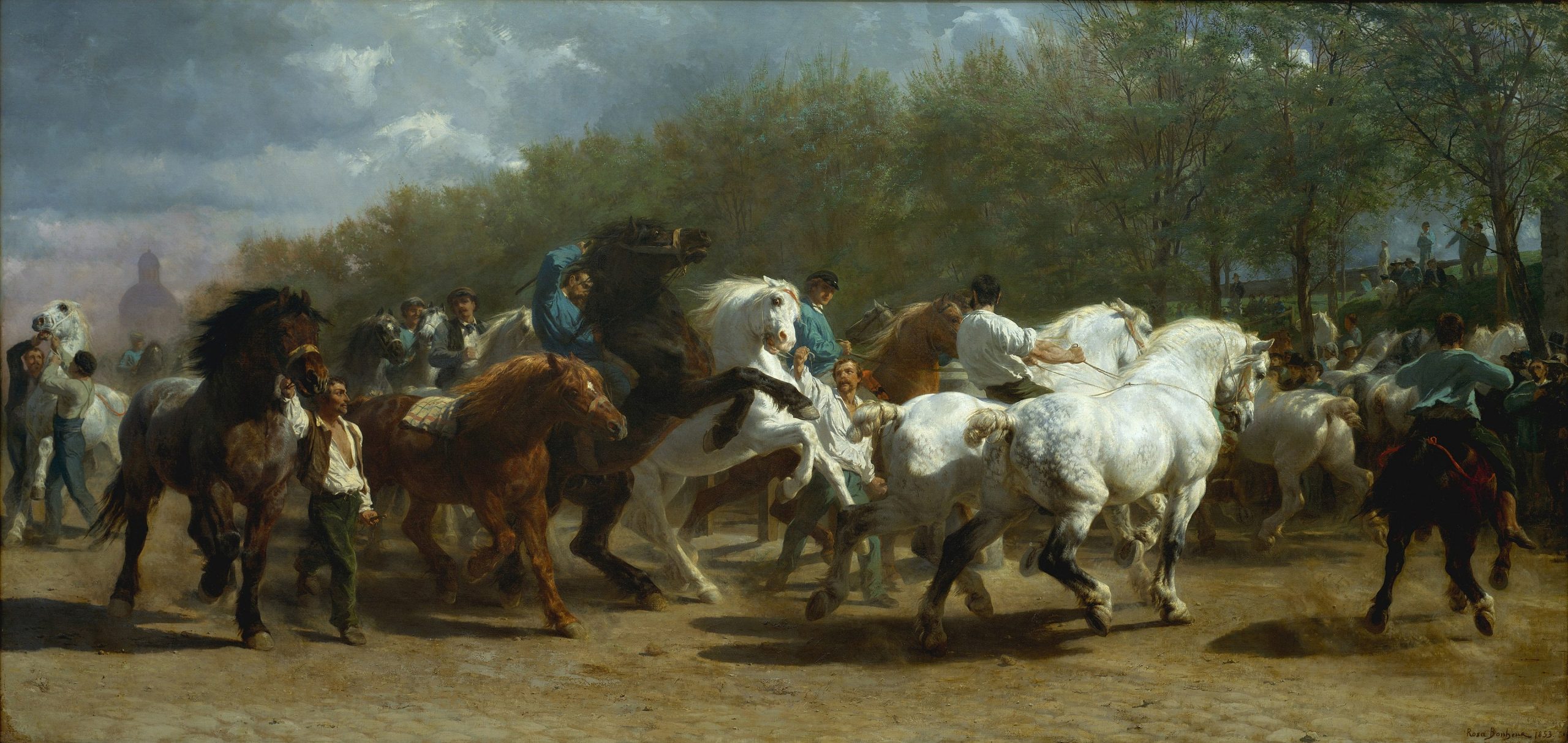 A procession of people riding various horses across a dry meadow
