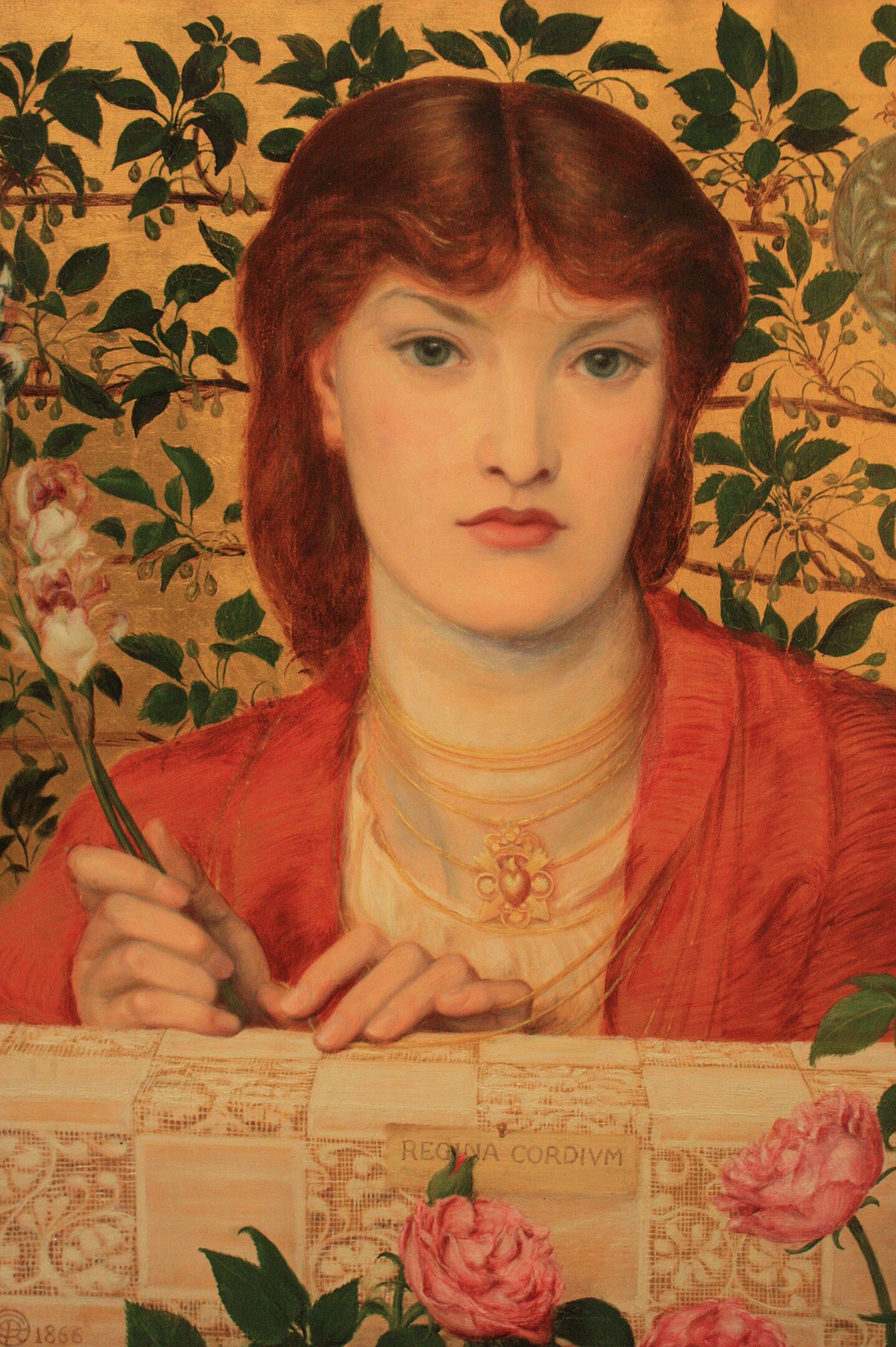A portrait of a woman with a floral background behind her.