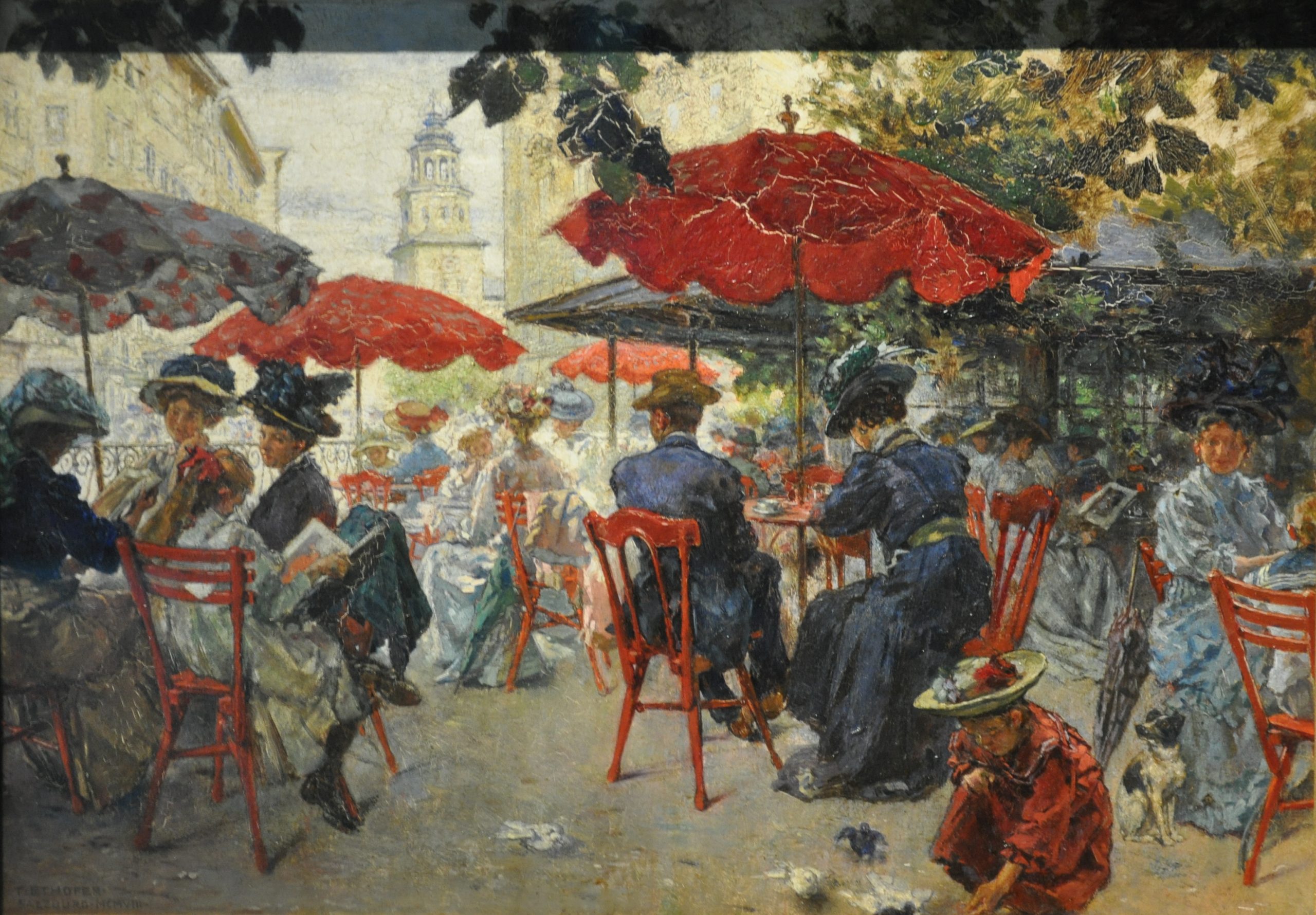 Men and women seated at an outdoor restaurant patio on a sunny day