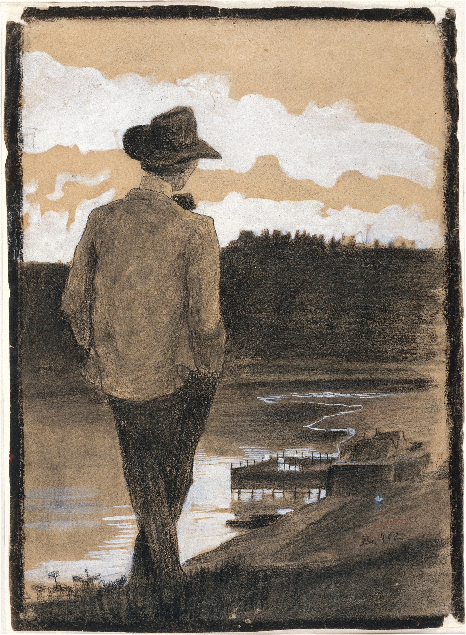 A man with his back turned towards the viewer looking out at a lake