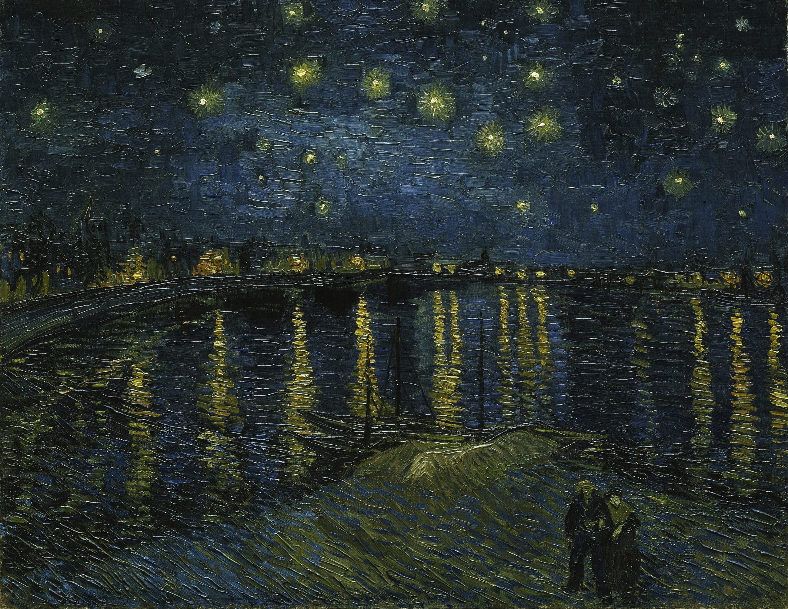 A landscape view of a river under a night sky full of stars