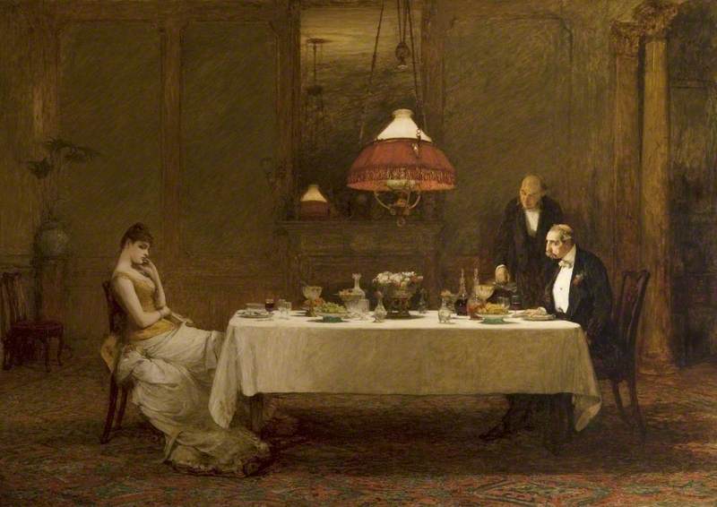 A man and a woman sitting across from each other at a dinner table with a butler standing beside the man