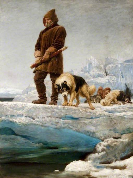 A man dressed in winter wear stands leads the way with a pack of wolves behind him while he stands on an icy hill.