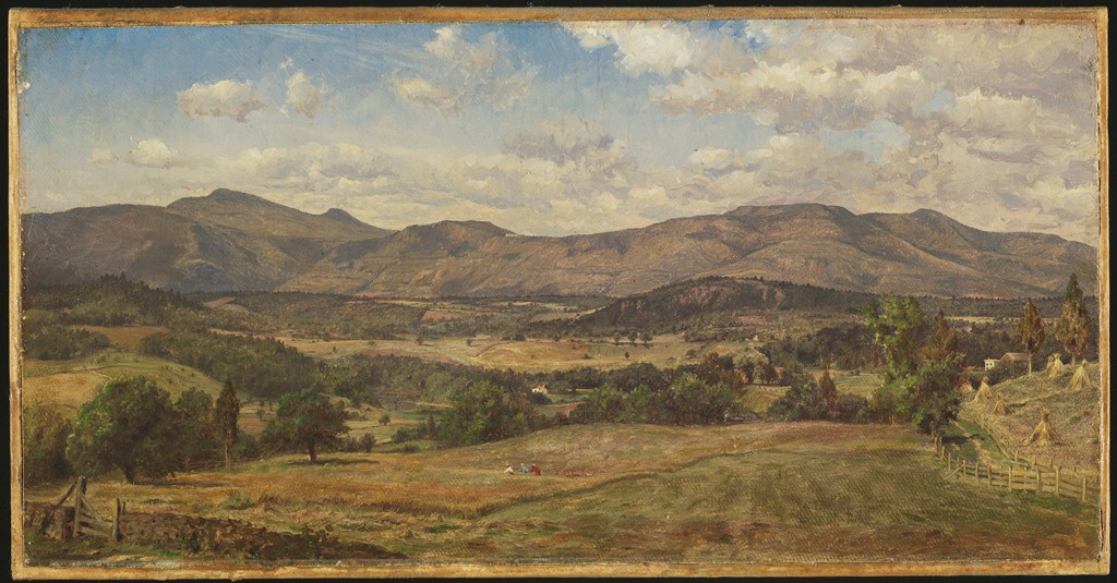 A landscape view of mountains in a valley