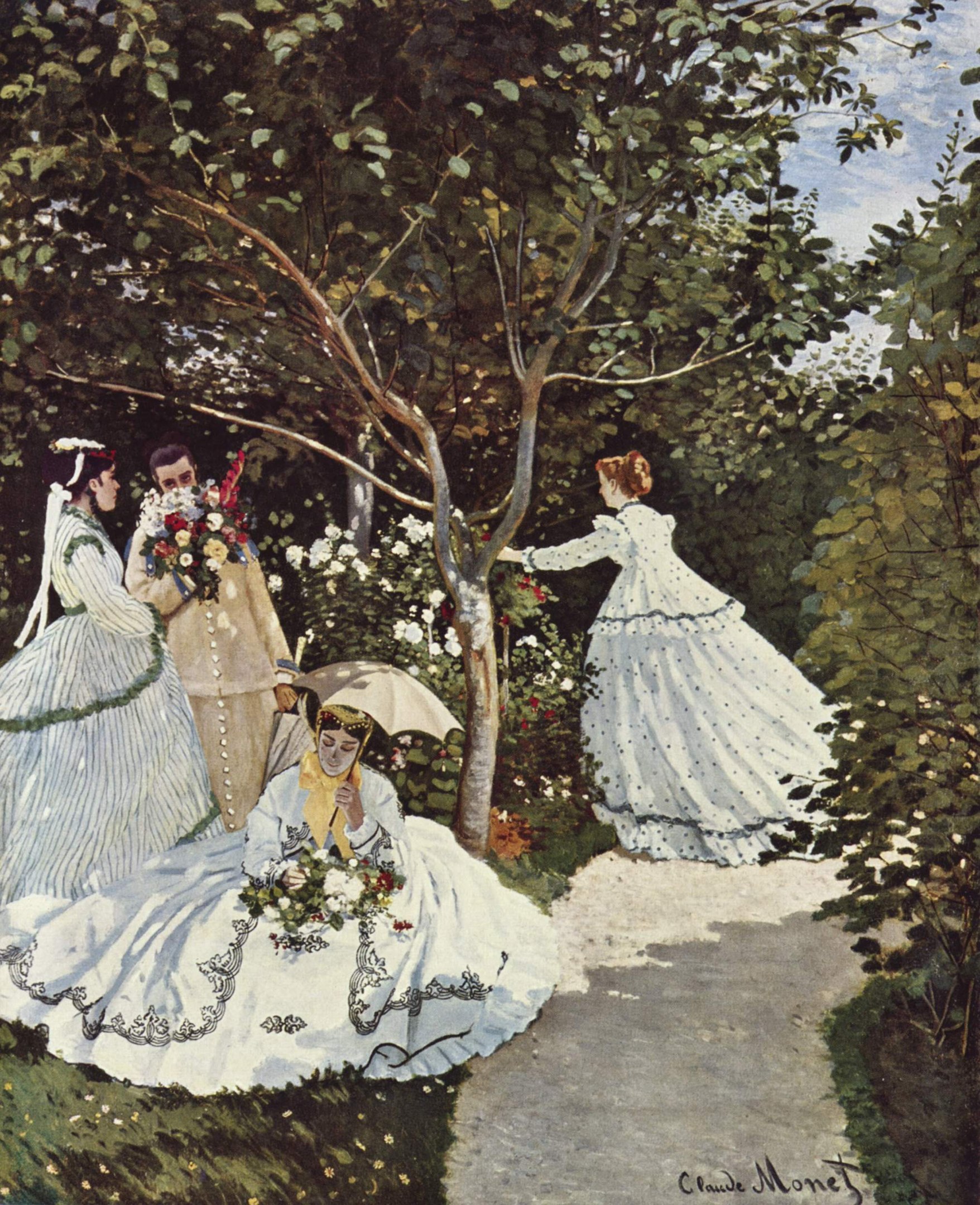 Four women under a tree in a garden