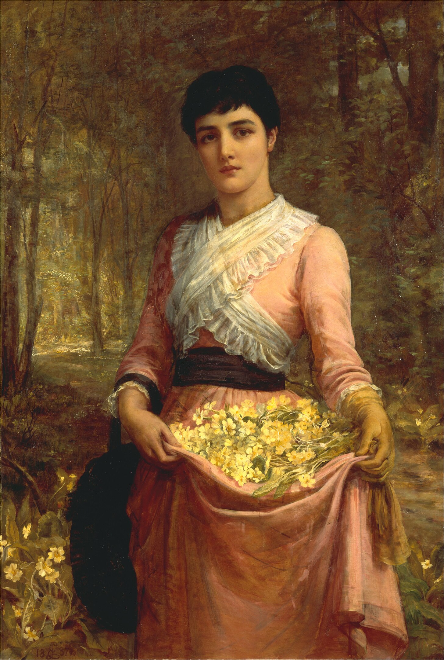 A woman in a forest holding the skirt of her dress to carry flowers