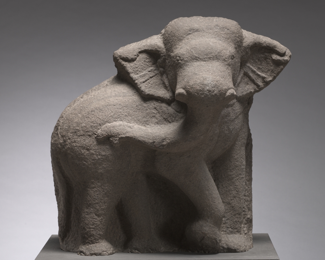 A photograph of a sculpture of an elephant.