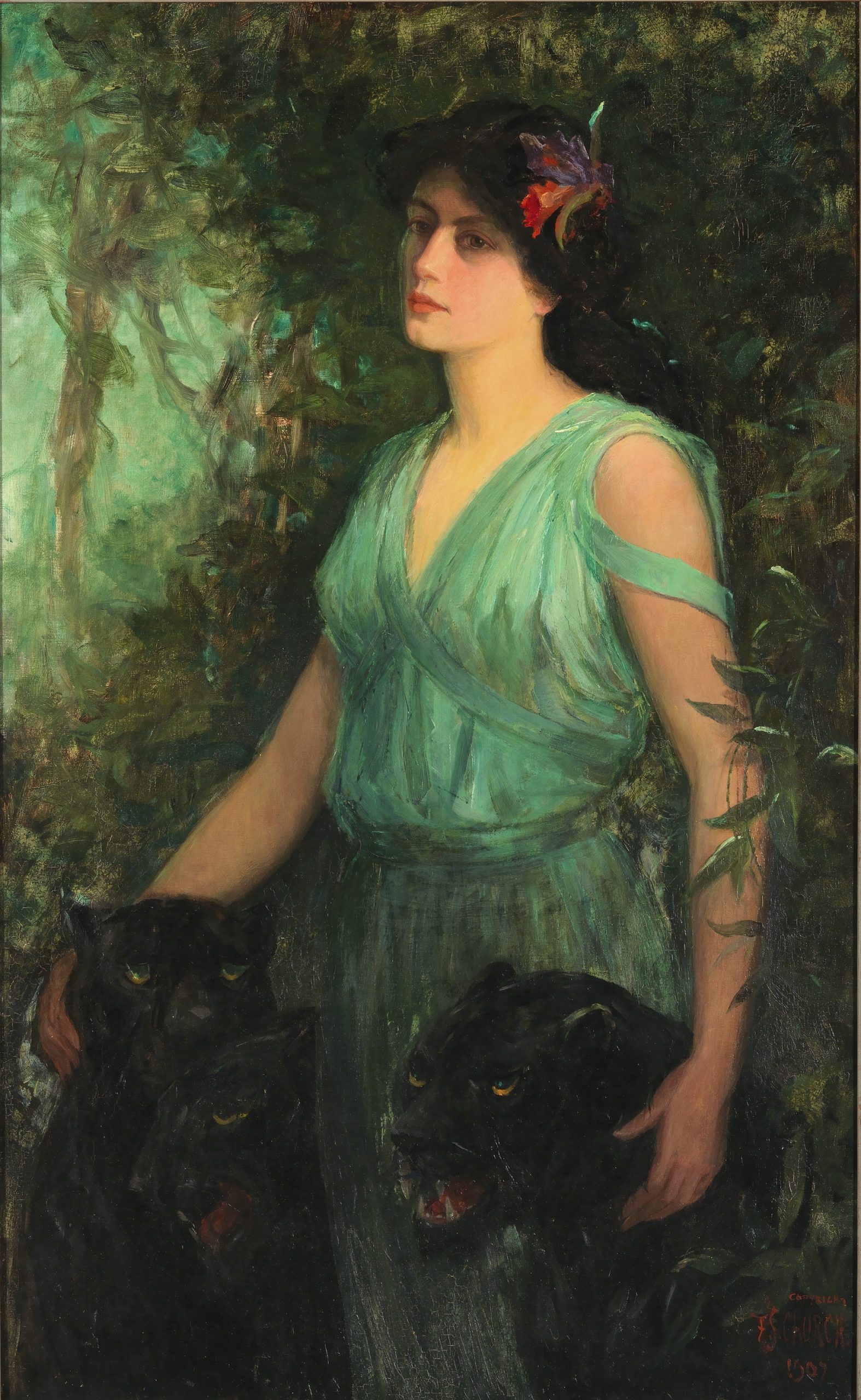 A portrait of a woman standing against the backdrop of a dark and leafy forest with two tigers by her sides.