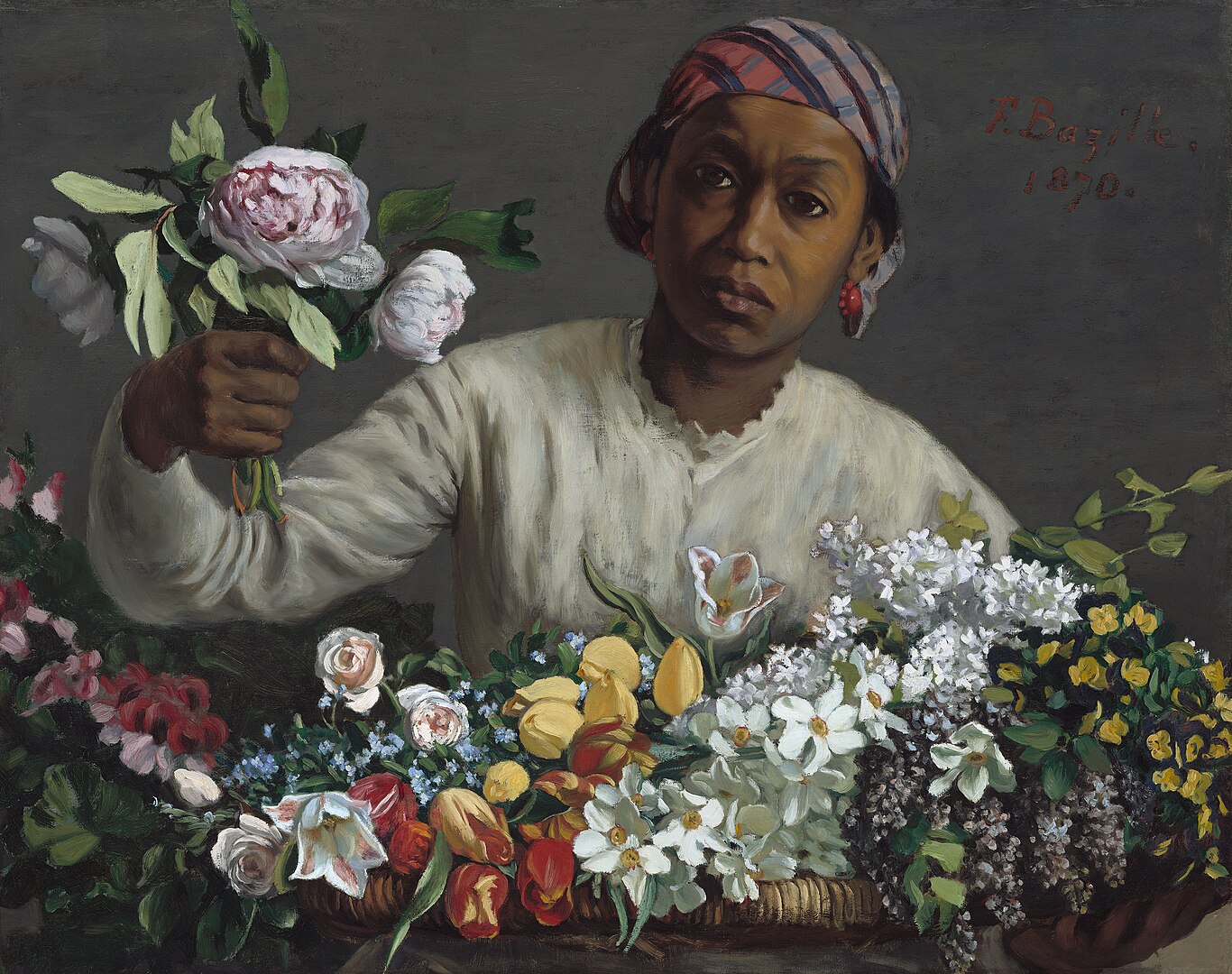 A young woman arranging peonies in a basket
