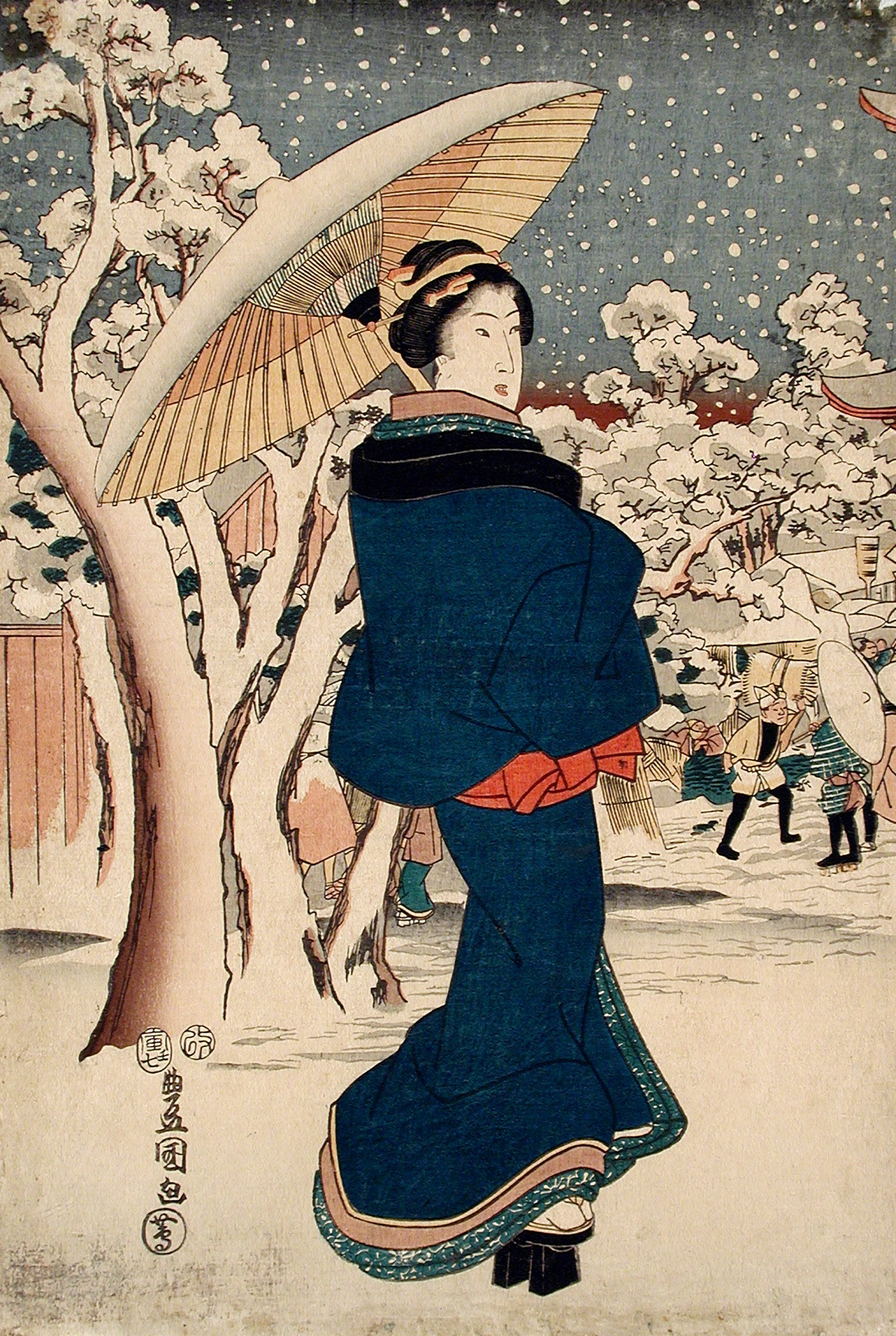 A woman with an umbrella walking through a snowy forest