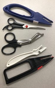 A selection of scissors and tools for cutting athletic tape.